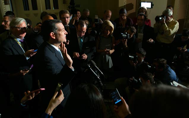 Sen. Ted Cruz (R-Texas) speaks to reporters after a Senate meeting on Capitol Hill in Washington, Oct. 16, 2013. (Photo: Doug Mills / The New York Times) 